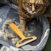 Fursprint Pro pet hair remover tool on couch clears fur quickly for a pristine sofa.