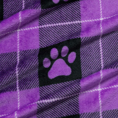 GreaterGood paw-print design blanket adds cute style and warmth during lounge sessions.
