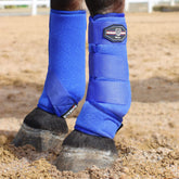 Harrison Howard front shock-absorbing boots in Aquamarine highlight leg wrap and fetlock cradle protection.
