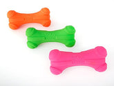 Hartz DuraPlay bone squeaky latex toy close-up highlights bacon scent and durability.