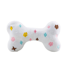 Haute Diggity Dog White Chewy Vuiton Bone embroidery details catch eyes during interactive play.