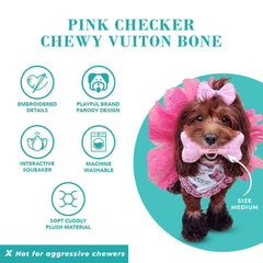Haute Diggity Dog pup playing fetch with Chewy Vuiton Bone.