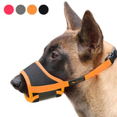 HEELE dog muzzle orange L side view shows secure fit for training.