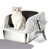 Helntova litter box with stainless steel scoop hanging for quick, hygienic cleaning.