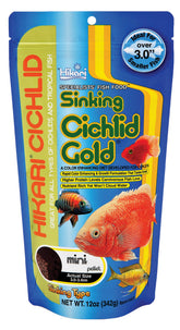 Hikari cichlid gold pellets mini close-up reveals color-enhancing formula for vibrant fish.