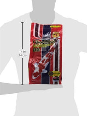Hikari Gold 4.4 Lb Medium koi feeding in pond, promotes steady color enhancement.