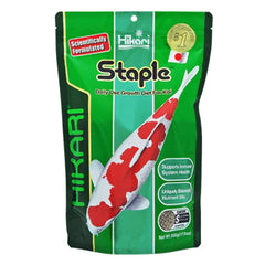 Hikari staple floating pellets in pond water for steady feeding and clarity