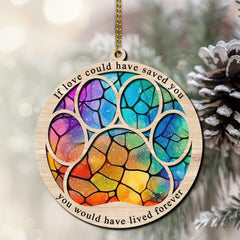 Hyturtle paw memorial suncatcher hanging from a gold cord on display