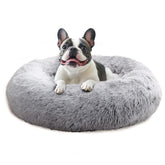 JOLLYVOGUE calming donut dog bed in smoke grey offers round support for restful naps.