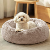 JOLLYVOGUE donut bed top view showing cozy rounded shape for calm lounging.