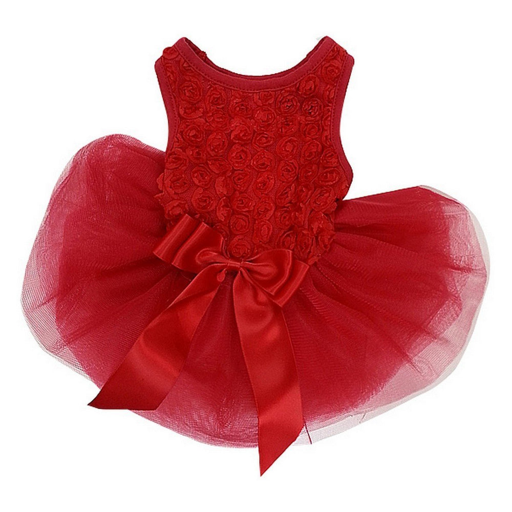 Kirei Sui Christmas Rosettes Dress front view on a small puppy, ideal for holiday photos.