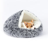 KITTYWOO round hooded pet bed in plush fabric offers cozy shelter for pets.