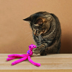 KONG Cat Wubba Mouse in action demonstrates rattle and hunting instinct stimulation.