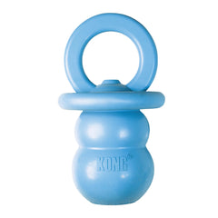 KONG Puppy Binkie close-up in hand showcases pacifier design for soothing teething puppies