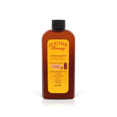 Leather Honey bottle closeup demonstrates non-toxic cleaner for safe maintenance on all colors.