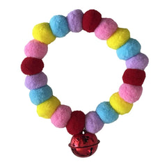 Leconpet pom pom dog collar closeup in red-pink showing playful style and vibrant texture.