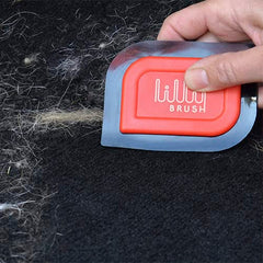Lilly Brush Mini Pet Hair Detailer in hand shows easy grip for quick fur removal.