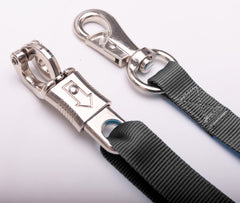 Loaged cross ties in a stable setup enabling easy repositioning for horses.