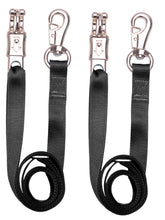 Loaged cross ties show panic snap and bull snap setup for secure horse tethering.