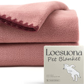 Loesuona two-pack soft fleece dog blanket on sofa for furniture protection.