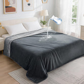 LOOBANI waterproof blanket on a bed provides 60x80 coverage with spill protection.