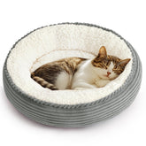 Love's cabin round donut bed outer view shows plush nest for cozy naps.