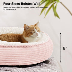 Love's cabin round bed pink stripe side view shows raised rim for neck and head support.