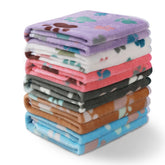 Luciphia blanket paw-print closeup for cozy pet comfort.