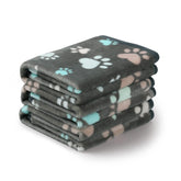 Luciphia small blanket 23x16 gray paw print keeps pets cozy on the couch.