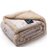 Luciphia waterproof pet blanket with paw print on couch offering cozy protection.
