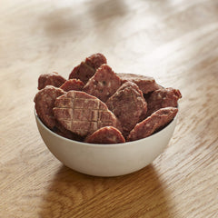 Milo's Kitchen beef sausage slices with rice texture close-up shows meaty chew