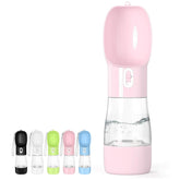 Misthis portable dog water bottle held outside for easy travel on walks