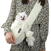 NATUYA small dog carrier sling front view for hands-free outdoor walks.
