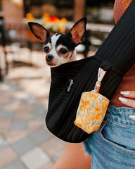 NATUYA small dog carrier sling shows wide comfortable shoulder strap for even weight distribution
