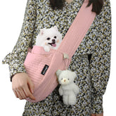 NATUYA small dog carrier sling close-up shows adjustable strap for secure hands-free walks.