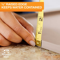 Raised edge on Neater Mat Cappuccino contains spills near bowls.