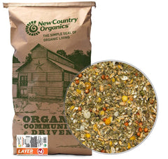 New Country Organics layer feed bag shows corn-free, soy-free nutrition.