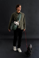 Noah & Paw dog sling carrier side view highlights adjustable strap for tailored fit during walks.