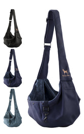 Noah & Paw dog sling in twill cradles small dogs during strolls for hands-free comfort.