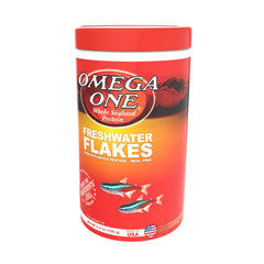 Omega One Freshwater Flakes dispensing jar demonstrates easy feeding and reduced waste