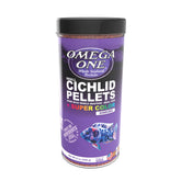 Omega One sinking cichlid pellets pouring from bottle for easy feeding.