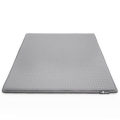 Paw Inspired cooling-orthopedic crate pad inside kennel for dog comfort and joint support.