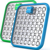 Pawtners stainless-steel large lick mat for dogs on crate—durable slow-feeding surface.