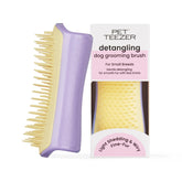 Pet Teezer detangling brush on lilac-yellow coat for gentle detangling and undercoat access.