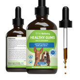 Pet Wellbeing Healthy Gums Drops applied to dogs' gums for targeted dental care.