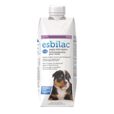 PetAg Esbilac puppy milk replacer bottle pouring for easy bottle-feeding.