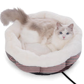 Petvolve heated cat bed indoor round view showing cozy warmth and compact shape for small pets.