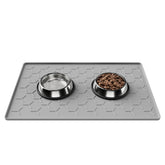 Pieviev raised-edge dog cat mat keeps spills contained for cleaner floors.