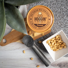 Puppy Cake Hoggin' Dogs dog enjoying a peanut-flavored creamy treat.