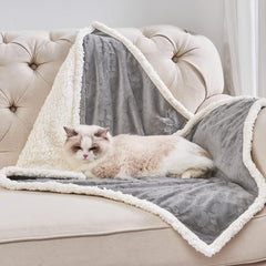 Qeils waterproof cat blanket showing spill-resistant outer layer for quick cleanup